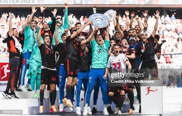 Players of Muenchen, Thomas Mueller, goalkeeper Manuel Neuer, Joshua Kimmich, Jamal Musiala etc. Celebrate the winning of the championship after the...