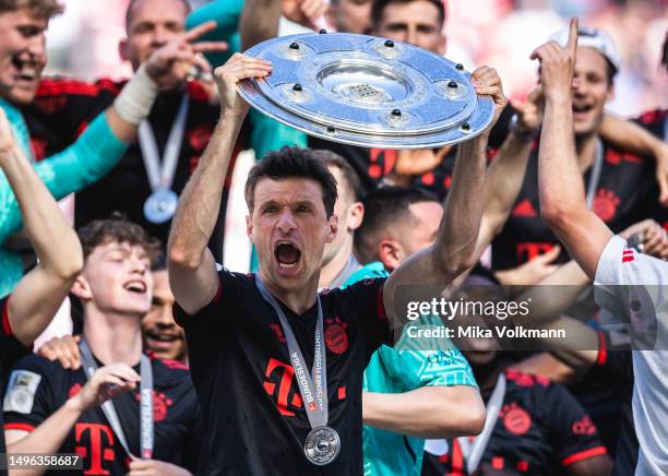 Thomas Mueller of Muenchen celebrates the winning of the championship at the ceremony after the Bundesliga match between 1.FC Koeln and FC Bayern...