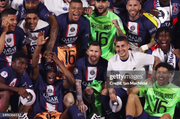 Lionel Messi is seen with Paris Saint-Germain team mates as they celebrate winning the Ligue 1 title during the Ligue 1 match between Paris...