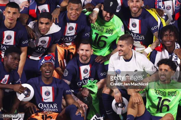 Lionel Messi is seen with Paris Saint-Germain team mates as they celebrate winning the Ligue 1 title during the Ligue 1 match between Paris...