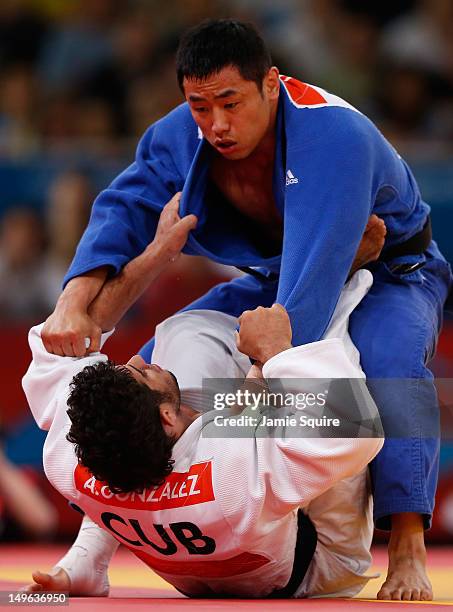 Dae-Nam Song of Korea competes with Asley Gonzalez Montero of Cuba during the Men's -90 kg Judo on Day 5 of the London 2012 Olympic Games at ExCeL on...