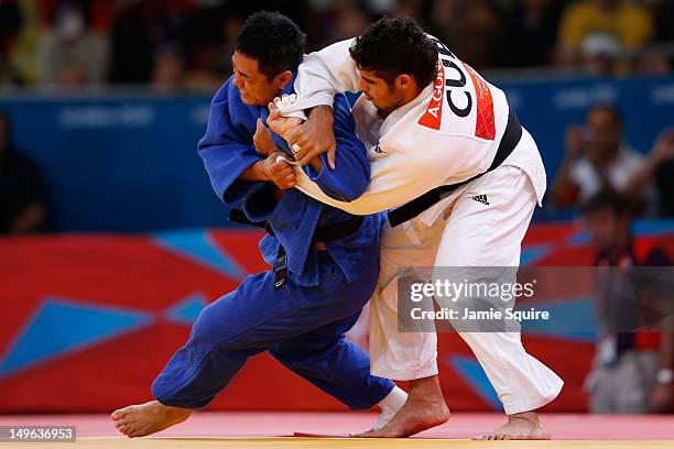 Dae-Nam Song of Korea competes with Asley Gonzalez Montero of Cuba during the Men's -90 kg Judo on Day 5 of the London 2012 Olympic Games at ExCeL on...