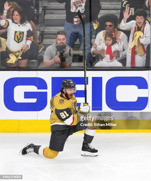 Jonathan Marchessault of the Vegas Golden Knights skates past fans dressed as Elvis Presley as he celebrates his power-play goal against the Florida...