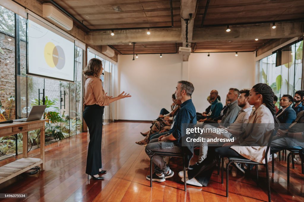 Woman presenting at a conference