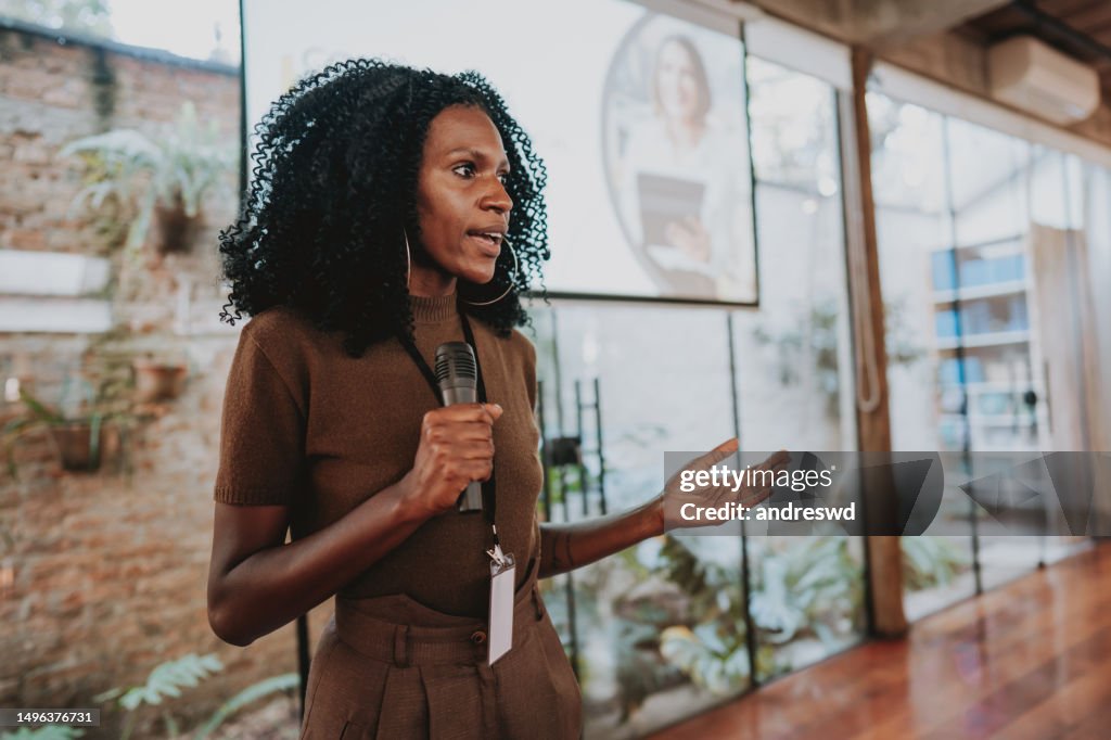 Woman giving speaker presentation