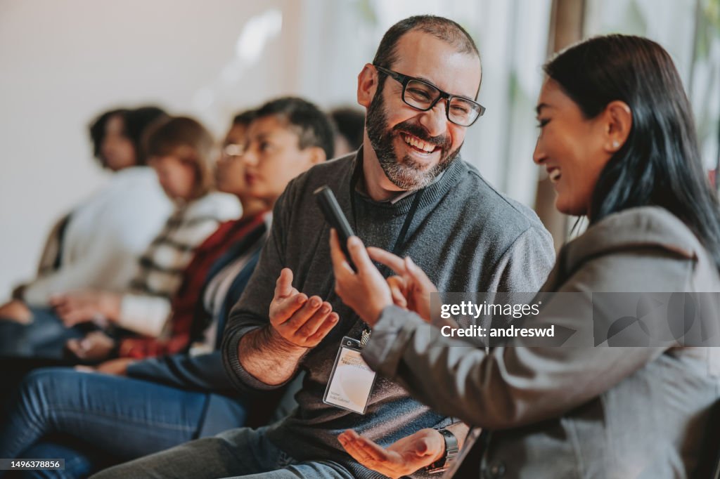 Showing smartphone during conference