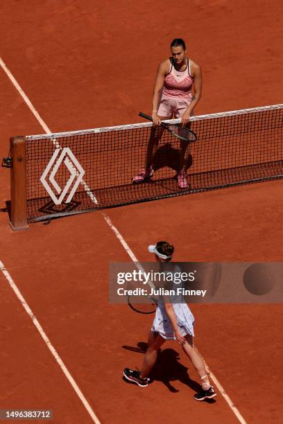 Aryna Sabalenka waits at the net as Elina Svitolina of Ukraine refuses to shake hands after the Women's Singles Quarter Final match on Day Ten of the...