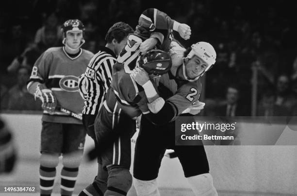 The Montreal Canadiens' Chris Nilan fighting with the Philadelphia Flyers' Dave Brown during the first period of a National Hockey League game at the...