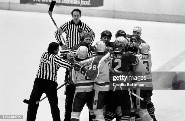 Players of the Los Angeles Kings and the Buffalo Sabres ice hockey teams fighting during a game at the Forum in Inglewood, California, March 10th...