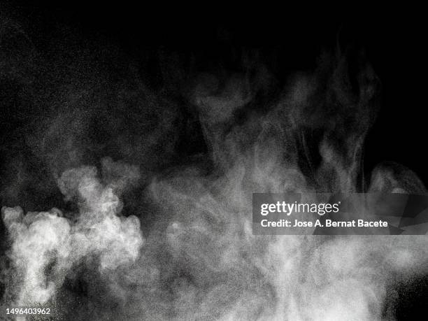 multiple explosions of smoke and dust on a white background. - vapor fotografías e imágenes de stock