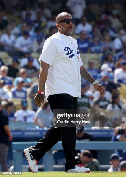Kenya Barris walks out to throw out a ceremonial first pitch before the game between the New York Yankees and the Los Angeles Dodgers at Dodger...