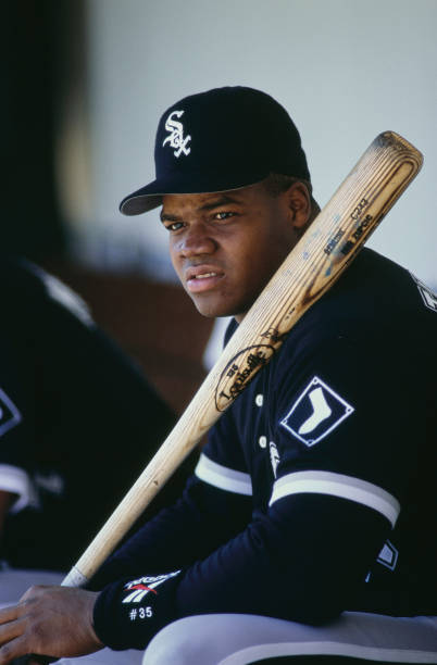 Frank "the Big Hurt" Thomas, Designated Hitter and First Baseman for the Chicago White Sox sits in the dugout during the Major League Baseball...