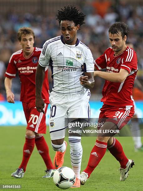 Anderlecht's Rubenilson Dos Santos aka Kanu vies with Ekranas' Marko Andelkovic during the Champions League third qualifying round first leg football...