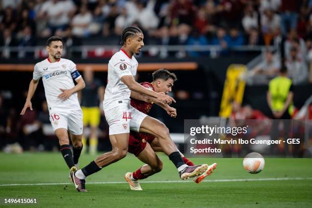Paulo Dybala of Rome scores his team's first goal against Loic Bade of Sevilla during the UEFA Europa League 2022/23 final match between Sevilla FC...