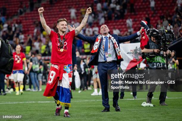 Ivan Rakitic and Sports Director Ramon Rodriguez Verdejo, Monchi, of Sevilla celebrating victory after the UEFA Europa League 2022/23 final match...