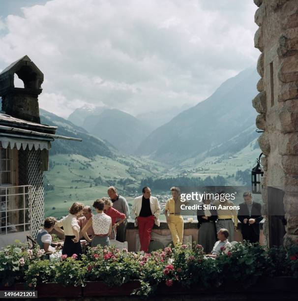 Prince and Princess Alexander von Hohenlohe mingle with other guests at a lunch party hosted by Baroness and Baron and von Pantz at Mittersill...