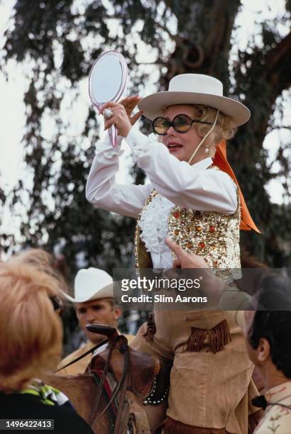 Hungarian-American actress and socialite Eva Gabor takes part in a rodeo parade through Palm Springs, California, 1970.
