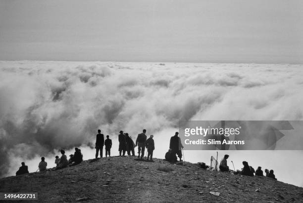 Visitors among the clouds at Croagh Patrick mountain, County Mayo, Republic of Ireland, 1962.