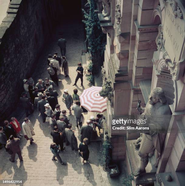 Visitors by the curtain wall of Heidelberg Castle, Heidelberg, Germany, 1962.