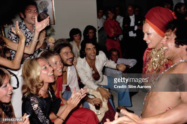 Mexican film actress Linda Christian and Spanish flamenco dancer Antonio Luis Soler entertaining friends in Marbella, Spain, 1971.