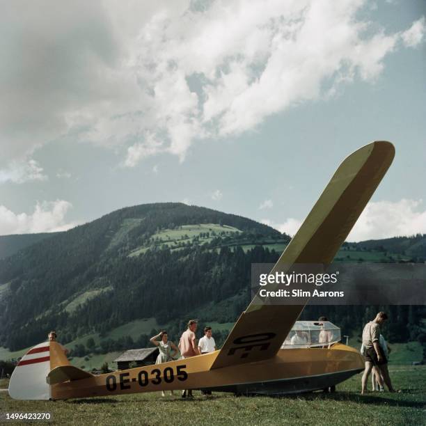 Glider rests on the ground by Mittersill Castle, Austria, 1958.