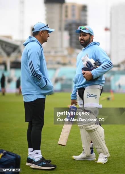 Rohit Sharma of India speaks to Head Coach Rahul Dravid during India training prior to the ICC World Test Championship Final 2023 at The Oval on June...