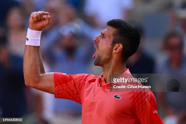 Novak Djokovic of Serbia celebrates winning match point against Karen Khachanov during the Men's Singles Quarter Final match on Day Ten of the 2023...