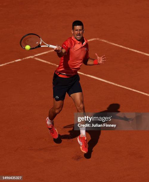 Novak Djokovic of Serbia in action against Karen Khachanov during the Men's Singles Quarter Final match on Day Ten of the 2023 French Open at Roland...