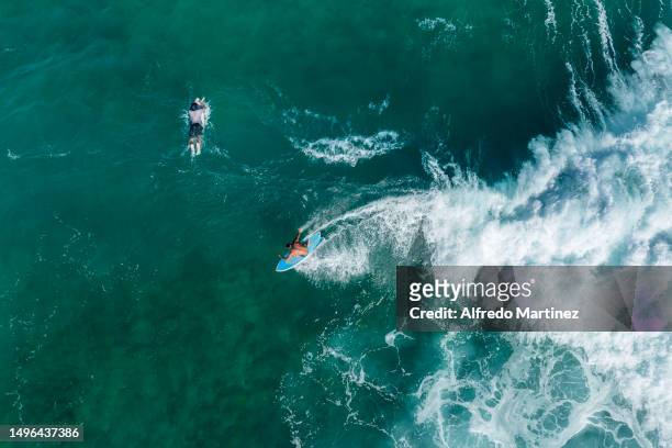 Surfers enjoy the waves at La Fortuna beach located in the Eastern Cape on June 02, 2023 in Los Cabos, Mexico. Big-wave conditions in Baja California...