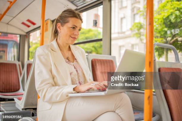 mature woman on public transportation - circunscrição eleitoral imagens e fotografias de stock