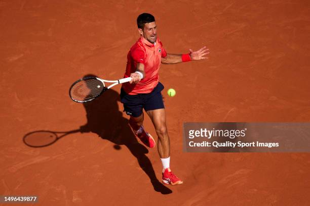Novak Djokovic of Serbia plays a forehand shot against Karen Khachanov during the Men's Singles Quarter Final match on Day Ten of the 2023 French...