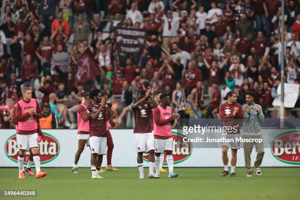 Torino FC players applaud their fans as they make a lap of the pitch following the final whistle of the Serie A match between Torino FC and FC...