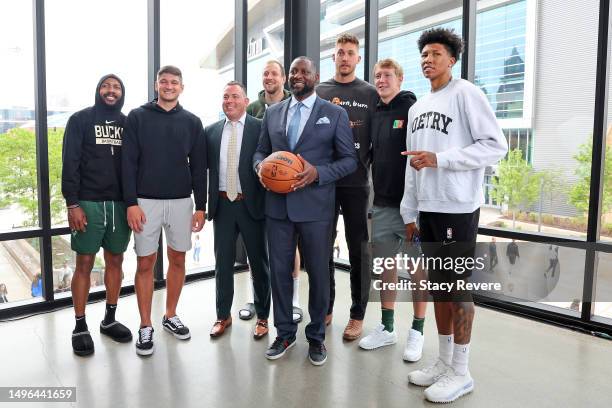 New head coach Adrian Griffin of the Milwaukee Bucks poses for a picture with players Jevon Carter, Grayson Allen, General Manager Jon Horst, Joe...