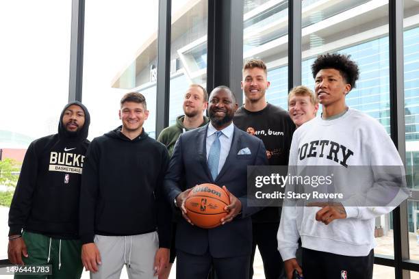 New head coach Adrian Griffin of the Milwaukee Bucks poses for a picture with players Jevon Carter, Grayson Allen, Joe Ingles, Meyers Leonard, AJ...