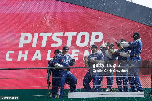 The pit crew of the NASCAR Next Gen Chevrolet ZL1 celebrate after winning the pit stop challenge prior to the 100th anniversary of the 24 Hours of Le...