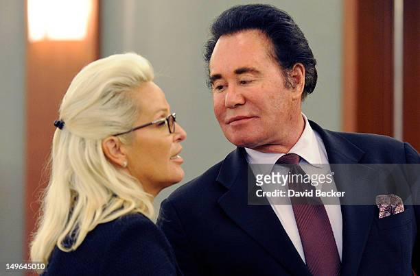 Entertainer Wayne Newton and his wife, Kathleen McCrone Newton, appear during a court recess at the Clark County Regional Justice Center on August 1,...