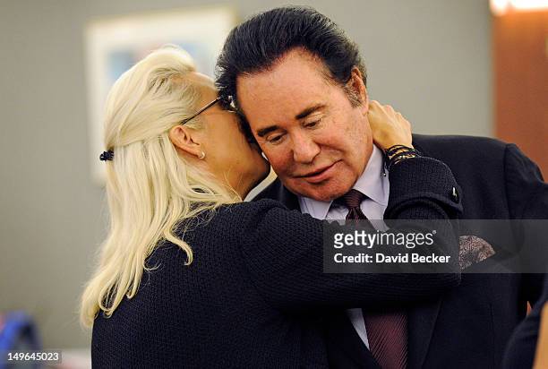Kathleen McCrone Newton whispers to her husband, entertainer Wayne Newton, during a court recess at the Clark County Regional Justice Center on...