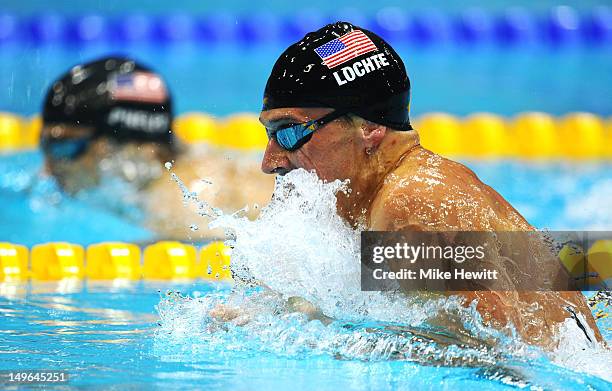 Ryan Lochte races against Michael Phelps of the United States in the first semifinal heat of the Men's 200m Individual Medleyon Day 5 of the London...