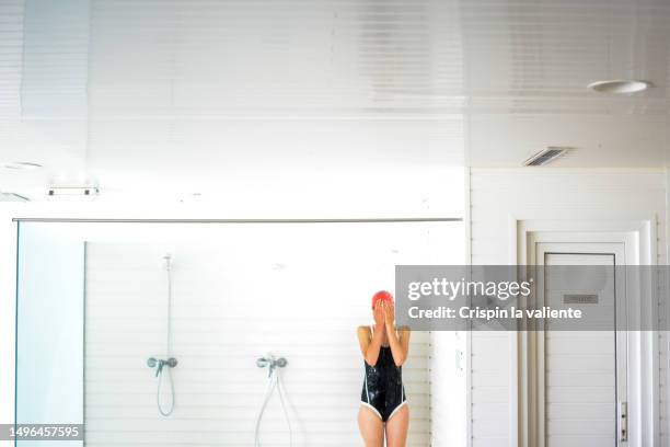 woman in shower of swimming pool - locker room bildbanksfoton och bilder