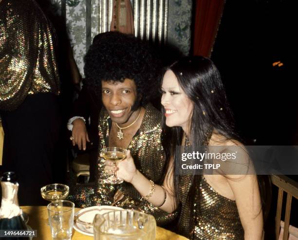 American musician Sly Stone and model-actress Kathy Silva smile during their wedding reception at the Waldorf-Astoria in New York, New York, June 5,...