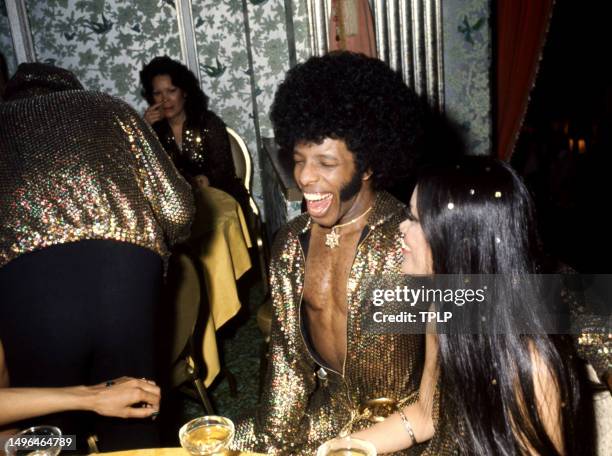 American musician Sly Stone and model-actress Kathy Silva laugh during their wedding reception at the Waldorf-Astoria in New York, New York, June 5,...