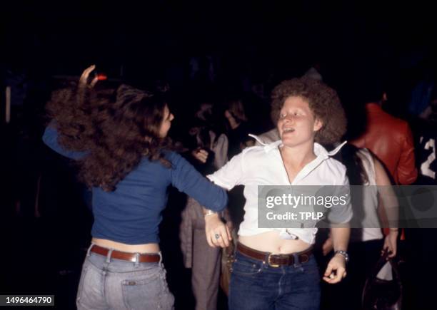 Two fans dance during Sly Stone's concert and onstage wedding at Madison Square Garden in New York, New York, June 5, 1974.