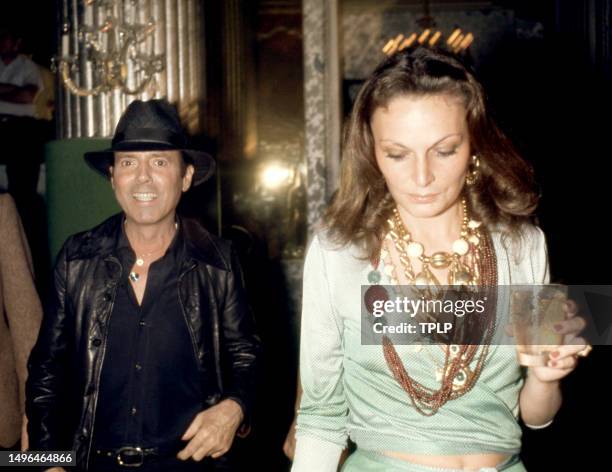 American fashion photographer Francesco Scavullo and Belgian fashion designer Diane von Fürstenberg during the Sly Stone wedding reception at the...