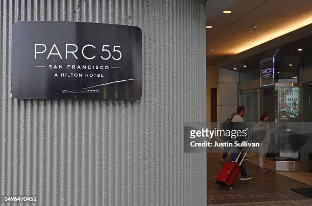 Customers enter the Parc 55 by Hilton Hotel on June 06, 2023 in San Francisco, California. As San Francisco continues to struggle with post-pandemic...