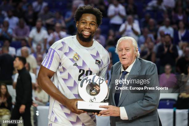Emiliano Rodriguez former Spanish international basketball player gives the trophy as the best player of the Liga Endesa for the month of May to...