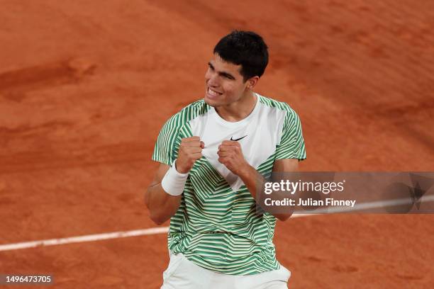 Carlos Alcaraz of Spain celebrates winning match point against Stefanos Tsitsipas of Greece during the Men's Singles Quarter Final match on Day Ten...