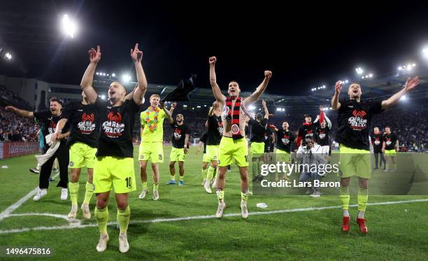 Ivan Prtajin of Wiesbaden celebrates with team mates after winning the Second Bundesliga playoffs second leg match between DSC Arminia Bielefeld and...