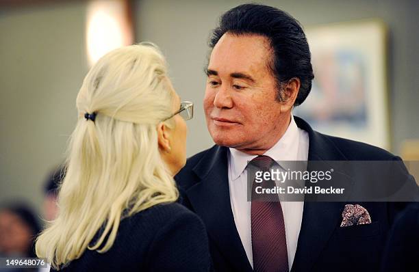 Entertainer Wayne Newton and his wife, Kathleen McCrone Newton, appear during a court recess at the Clark County Regional Justice Center on August 1,...