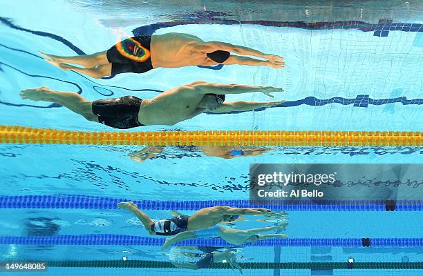 Ryan Lochte of the United States and James Goddard of Great Britain compete in the first semifinal heat of the Men's 200m Individual Medley on Day 5...