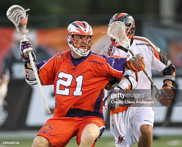 Casey Cittadino of the Denver Outlaws plays against Kevin Crowley of the Hamilton Nationals in a Major League Lacrosse game on July 28, 2012 at Ron...